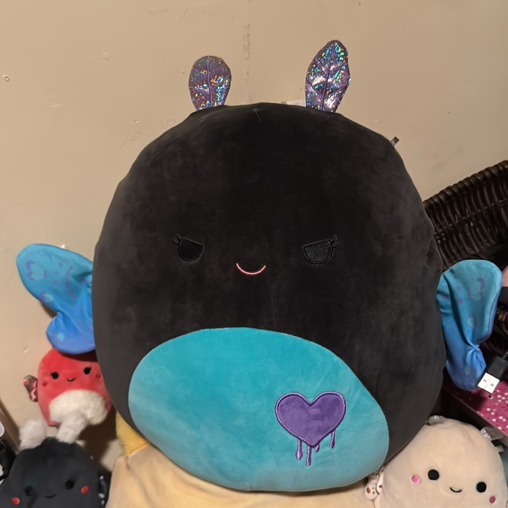 Salem the moth valentine squishmallow with mischievous eyes and melting heart